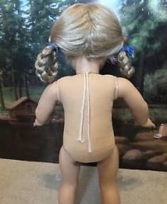 Like the American Girl dolls made prior to 2016, the Anniversary dolls have neck strings