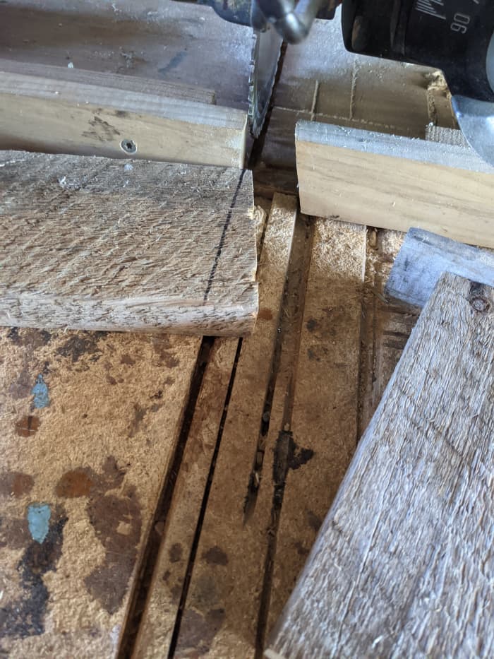 Cut middle of board at an angle. I used a sharpie to trace the angle that the lath crossed. Then used the radial arm saw to cut on the line.