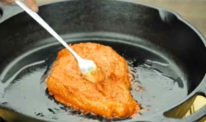 Step 7: Cook the chicken over low flame.