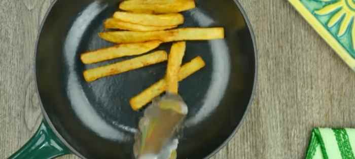 Step 9: Assemble: Spread a layer of French fries.