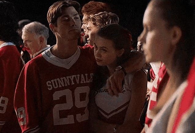 One of multiple "tricks" the movie uses to try convincing the audience that Deena is looking at a guy when she's actually looking at the girl in frame.