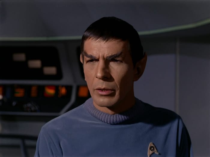 Leonard Nimoy plays Spock, the only character to carry over from the first pilot to the regular series of Star Trek. His character has also remained active even through the present day Star trek reboots by J.J. Abrams.