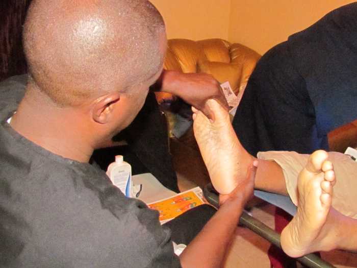 Robert Fulford III, works on the feet to stimulate possible circulation through organs within the body.