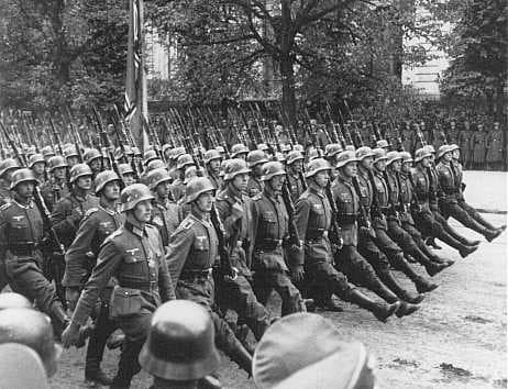 German troops parade through Warsaw after the surrender of Warsaw, Poland, September 28-30, 1939. United States Holocaust Memorial Museum.