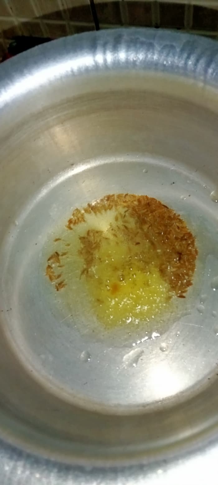 Heat ghee in a cooking pot. Add cumin seeds and asafoetida. Sauté until cumin seeds turn golden brown.