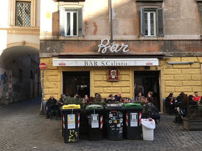 This unflattering photo includes a row of garbage cans to stress the fact that you aren't getting a table here to marvel at the architecture or artistry. This is a much-needed pitstop for all you coffee and beer lovers.