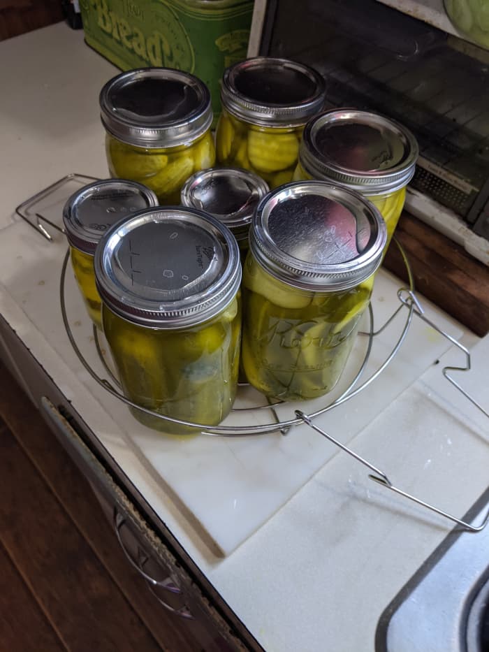Remove jars from boiling water bath and let sit on counter overnight. They will loudly ping as they seal.