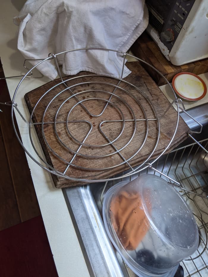 jar lifter on cutting board or other suitable counter protector. The brine will be hot as you place it in the jars.