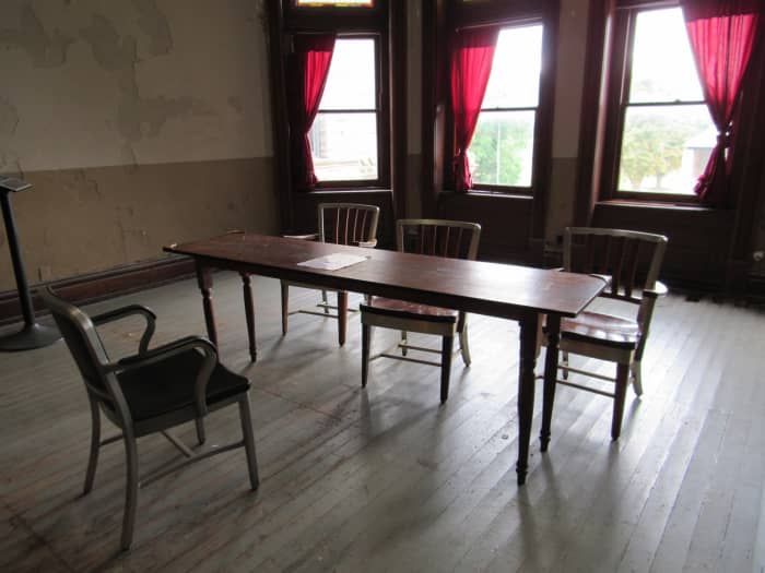 Residential room for the chaplain. This also served as the parole board room in The Shawshank Redemption.