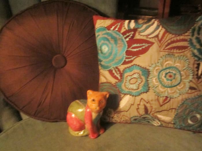 Like new pillows for a dollar or so apiece. There's my cat from Africa, too! Yard sales are great for finding decorative household items.