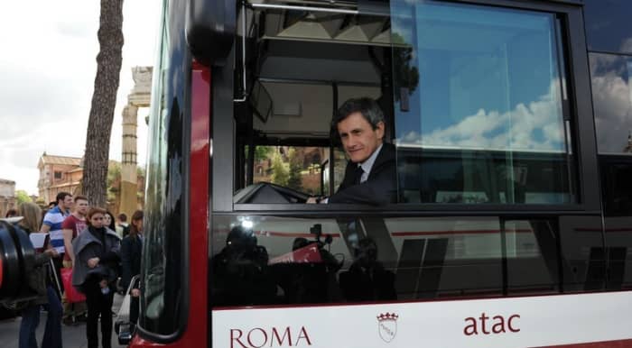 Former mayor of Rome Gianni Alemanno showing off one of Rome's new buses and looking suspiciously pleased with himself.