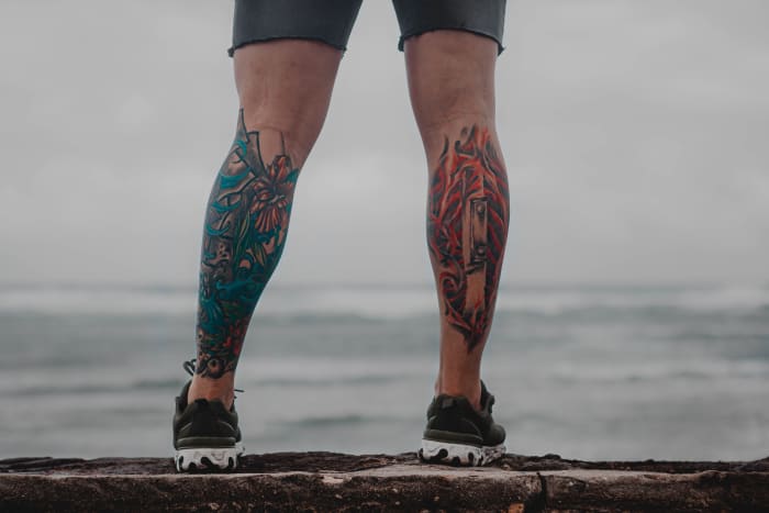 The masses of muscles on the backs of the calves protect the bone, so that spot is less painful for tattoos.