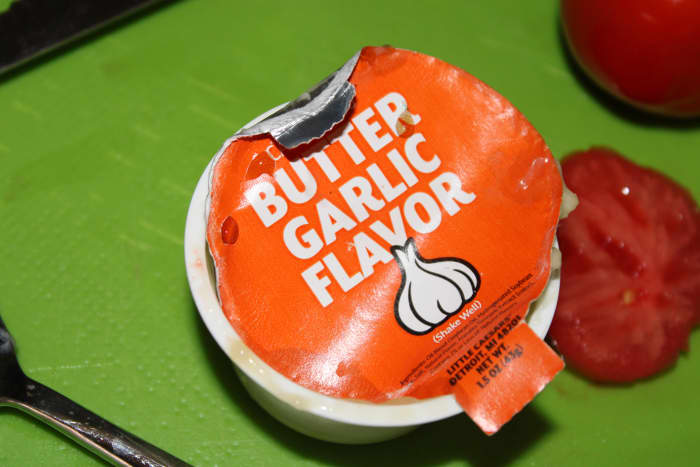 I love the garlic butter from my local pizza joint! I use their garlic butter in my poor man's tomato bread.