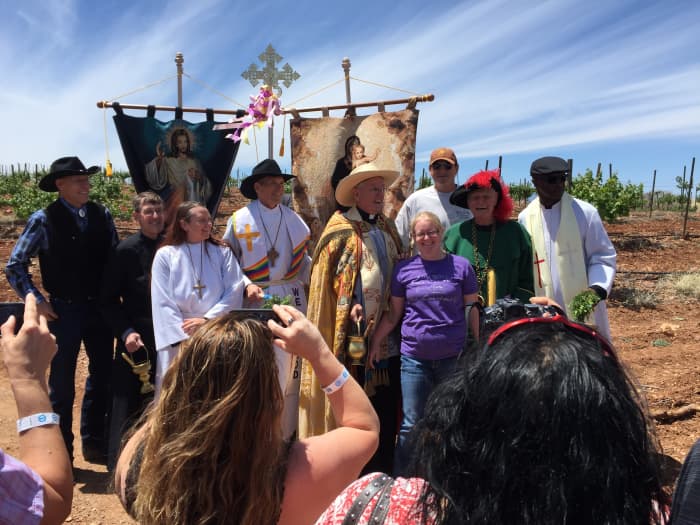 Local clergy in the vineyard in April 2017 to bless the vines at the start of the growing season. Woman in blue is Dr Dutt's granddaughter who now runs the winery. Dr. Dutt is to the right of her and wearing the garb of an ancient order of winemaker.