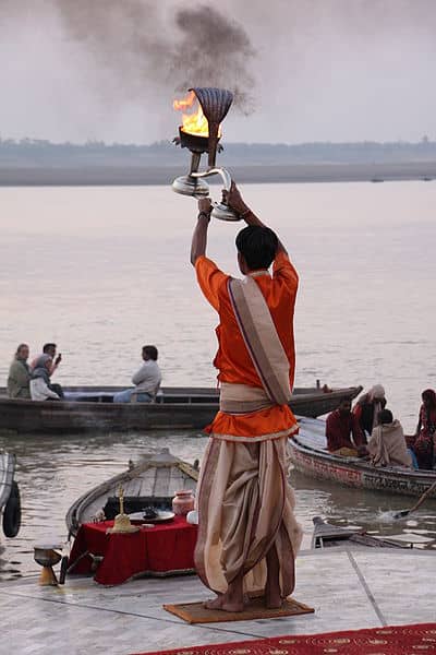 A priest performs the aarti at Varanasi that is a ritual to give thanks to the River Ganges and to seek its blessings.