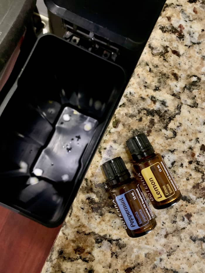 Adding a few drops of essential oil to some cotton balls and placing them on the bottom of the trash bin can help deodorize the kitchen trash can.