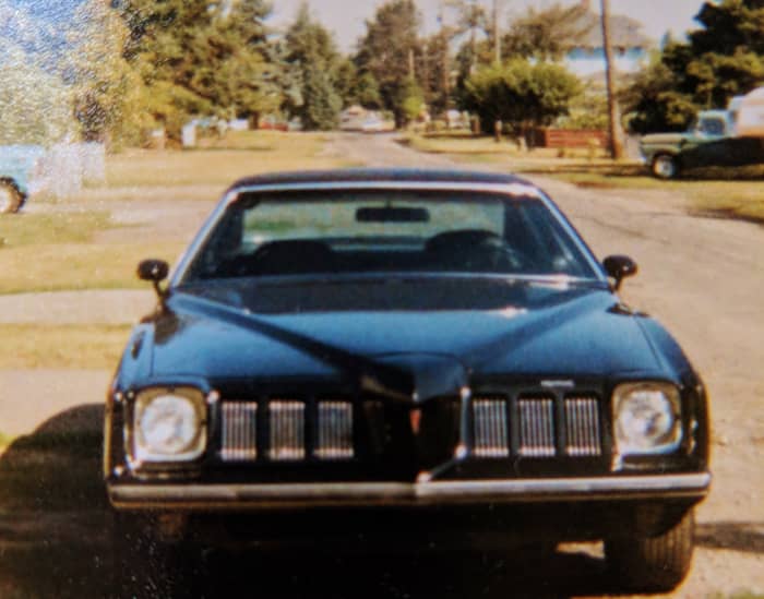 '73 Pontiac GrandAm, Blk, blk, blk with elec sunroof and 455. This bad girl was her all time favorite
