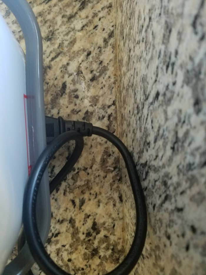 The plug for the power cord on the TLOG Mini Rice Cooker is in the back, so it can't be placed flush against a wall