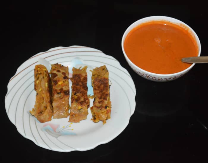 Serve paneer and wheat flour stuffed dumplings hot with red chutney or a spicy sauce. Enjoy this healthy and delicious breakfast!