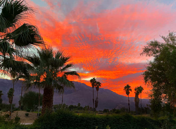 View of sunset over San Jacinto Peak from a neighborhood street in Palm Springs, CA.
