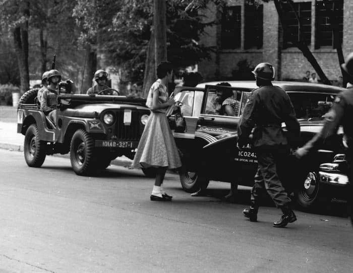 Soldiers from the 101st Airborne Division escort African-American students to Central High School in Little Rock in September 1957.