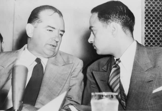 Senator Joseph McCarthy (left) chats with his attorney Roy Cohn during the Senate McCarthy-Army Subcommittee hearings.