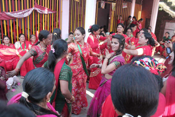 Ladies dancing in a temple in Lalitpur, Nepal on the occasion of Teej.