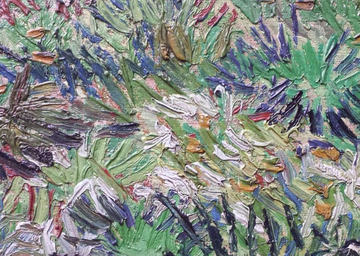 A close-up of a Van Gogh painting. Notice how the paint is thick and sticks up from the surface in ridges and bumps.