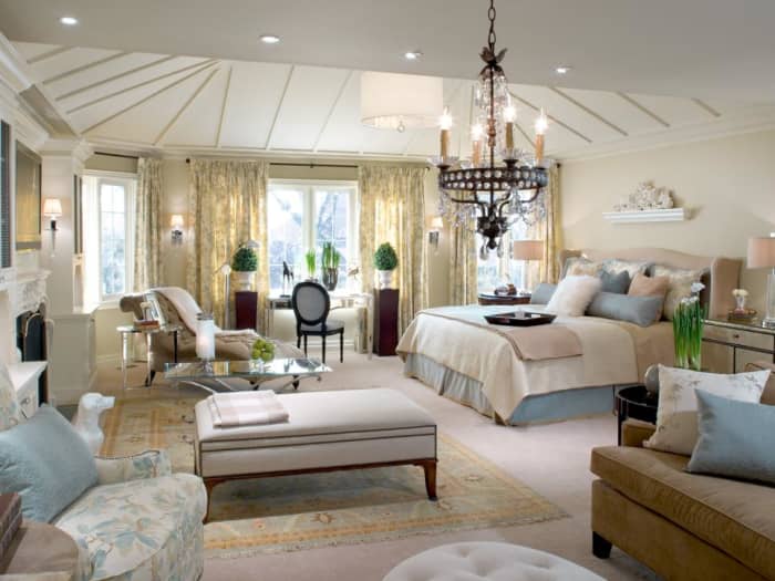 A study area solves the bay windows' identity crisis, and both creamy new carpeting and an elegant area rug create continuity between new sitting areas.