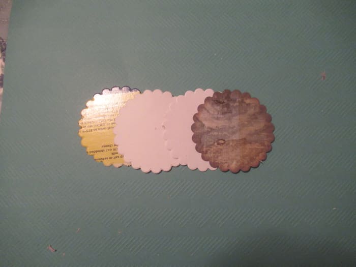 The pieces for the artist trading coin include 2 pieces of cardstock, one piece of cardboard and the top piece of Patterned paper