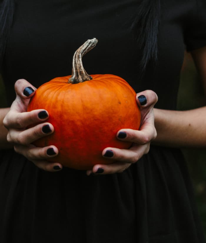Ask friends to bring a pumpkin, and they can have fun carving it. Photo by Kristina Paukshtite from Pexels
