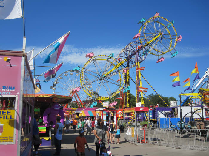 The midway features more than 30 attractions, including the famous double ferris wheel and 20 kid-friendly rides and attractions.
