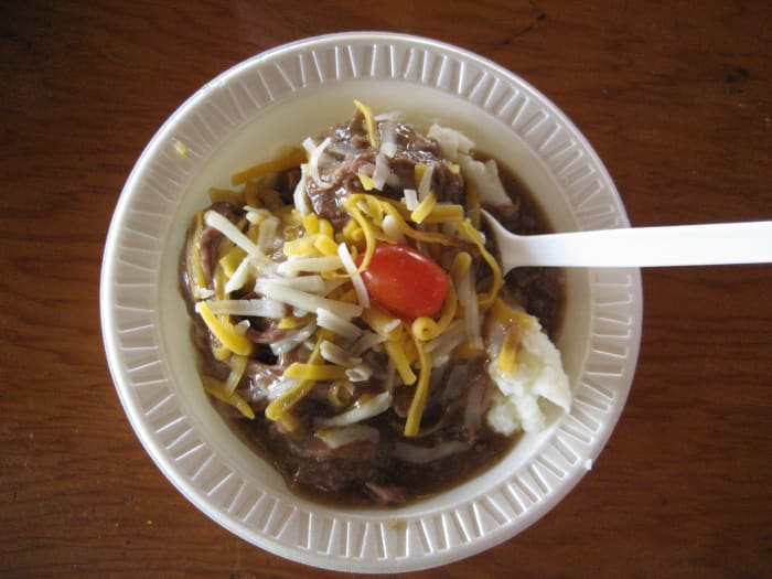 The "hot beef sundae" at the Cattlemen's Beef Quarters is hot beef and gravy over a scoop of mashed potatoes and a cherry (tomato) on top.