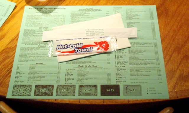 Accoutrements: Menu placemat, hand cleaning towel, chopsticks, napkin.