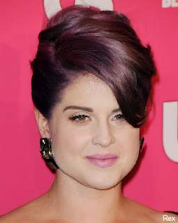 Kelly Osbourne in purple hair. Midnight purple hair color in a sophisticated updo.