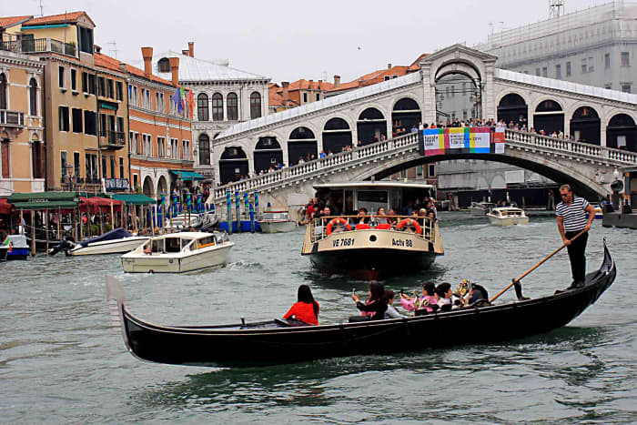 The Rialto Bridge and the quintessential image of Venice - a gondola on the Grand Canal. Looking at this photo, one wonders why there aren't more boating accidents on the canal?