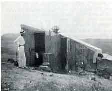Charles Greeley Abbott in front of the shelter he and Angstrom used during the 1912 expedition in Bassouj, Algeria.