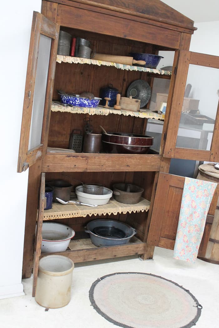 Typical kitchen cupboard used in vintage kitchens. The screen wire kept flies out of fresh baked pies.