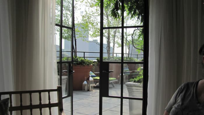 Inside of the Terrace bar. Beautiful french doors with silk curtains open up to the outdoor lounge. There was a perfect breeze blowing through as we took in the beauty.