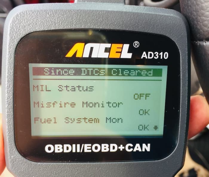 ANCEL AD310 Showing I/M Readiness status of the first three items. Press down arrow for more.
