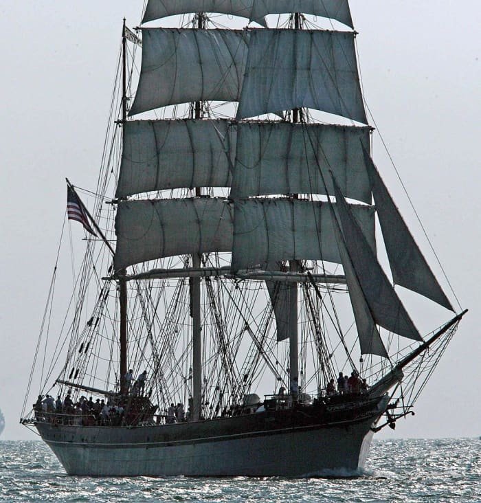 The tall ship Elissa, which has sailed in three centuries, sails up the channel into Port Galveston, Texas.