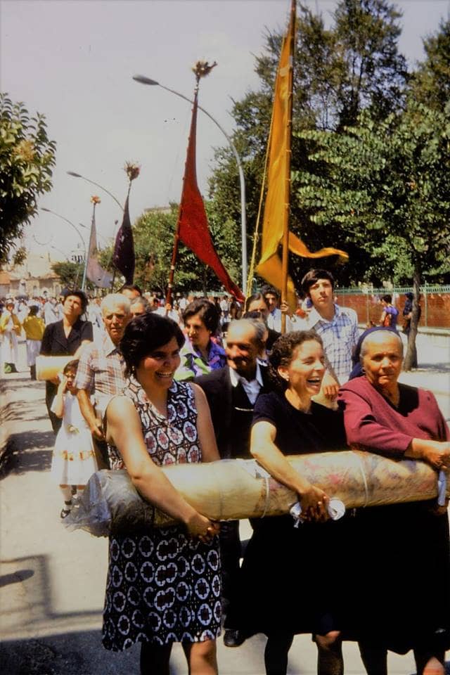 Devotees of this Madonna, at this Madonna feast sometime buy this large candela, then they walk in the procession holding this large weight in their arms for hours. So, they give money and work hard, because they believe this Madonna could help them