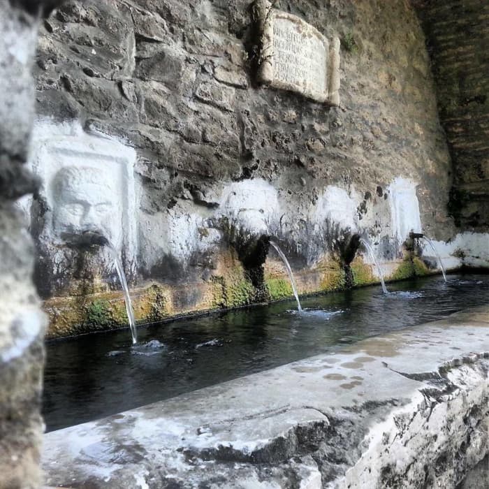 One of the two troughs with four spouts at the old fountain of Capo Daqua. For anyone interested in seeing how people used to build with rubble stones in the past, here is a good example, of course you can also see some repairs done lately.