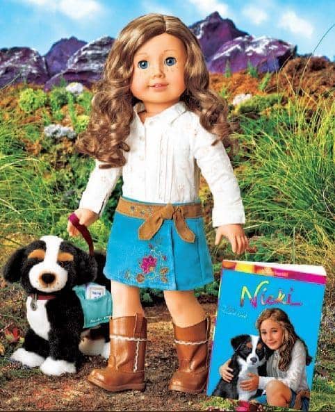 Nicki, the 2007 Girl of the Year, pictured with Sprocket, the guide dog she is training.