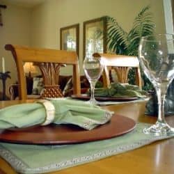 The formal look of polished wood, celadon green placemats, a gracious living mark this look as truly Southern but with a soft and easy look that came from those sweet Gulf breezes.