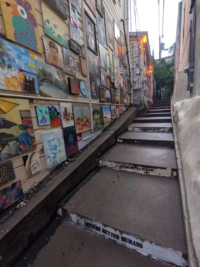 Like many of the old, outdoor stairs in Bisbee, this set is between two buildings with the wall on the left doubling as a place to display art.