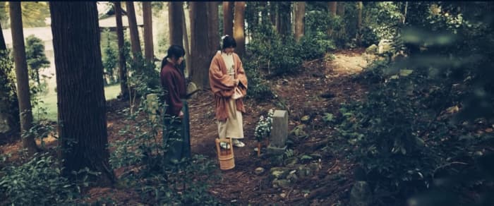 Courtesy of Netflix and Warner Bros. Kenshin and Kaoru visit Tomoe's grave stone near Kyoto in "Rurouni Kenshin: The Final."