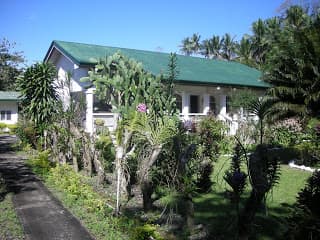 This is the front yard of the main House built in 1998. The front is the national road and at the back is the beach.