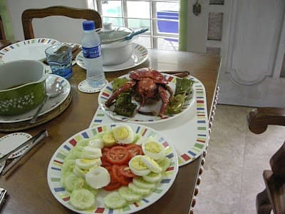 Coconut lobster served with fresh tomatoes and cucumber from the vegetable garden of Chateau Du Mer, Marinduque, Philippines