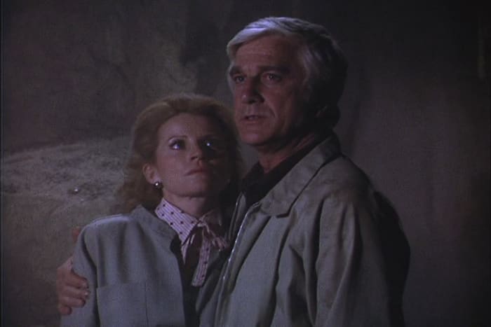 The Johnson's (Julie Sommars and Leslie Nielsen) support each other as they try to escape from a collapsed cave